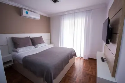 a bedroom with a bed and a television in it at Departamento en Nueva Córdoba in Cordoba