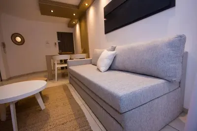 a living room with a couch and a table at Departamento en Nueva Córdoba in Cordoba