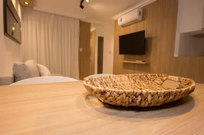 a wicker basket sitting on top of a wooden table at Departamento en Nueva Córdoba in Cordoba