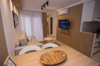 a living room with a table and a couch at Departamento en Nueva Córdoba in Cordoba