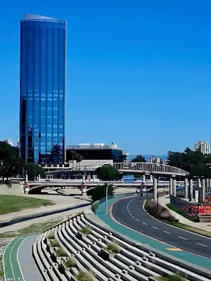 a winding road in a city with a tall building at Coral State Premium Tower in Cordoba