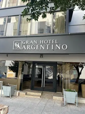 a building with a sign on the front of it at Gran hotel argentino in Villa Carlos Paz