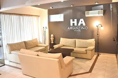 a living room with two couches and a table at Gran hotel argentino in Villa Carlos Paz