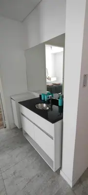 a bathroom with a sink and a mirror at Lake in Villa Carlos Paz