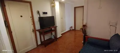 a living room with a flat screen tv and a couch at Departamento Centrico Cordoba in Cordoba