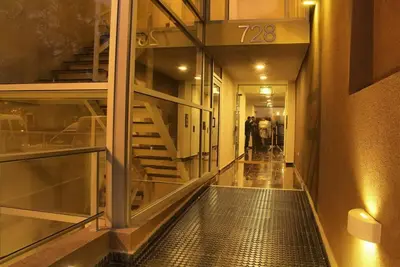 a hallway with a staircase in a building at Dptos Córdoba -Guemes, Sobre la Cañada, vista al Paseo de Artesanos in Cordoba