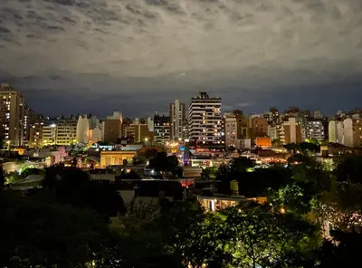a view of a city at night with lights at Dptos Córdoba -Guemes, Sobre la Cañada, vista al Paseo de Artesanos in Cordoba