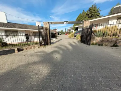 a gate to a driveway in a house at Casa Tío Luis in Villa Carlos Paz