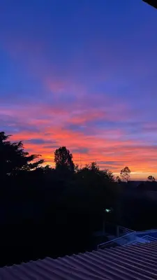 a sunset with a purple and red sky at Cabañas Maranatha in El Rincón