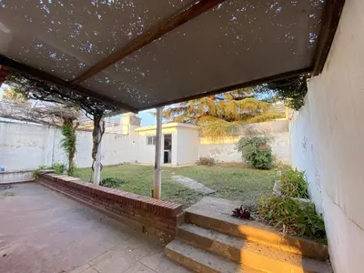 an outside view of a house with a patio at Departamento PARQUE Velez Sarsfield, zona sur - Cordoba capital in Cordoba