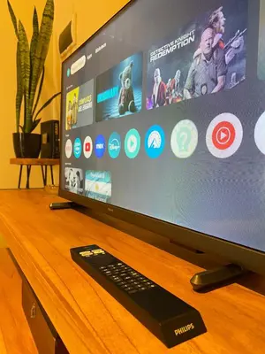 a computer monitor on a wooden table with a keyboard at Departamento PARQUE Velez Sarsfield, zona sur - Cordoba capital in Cordoba