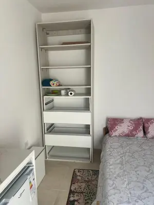 a small bedroom with a bed and a closet at studios in Cordoba in Cordoba