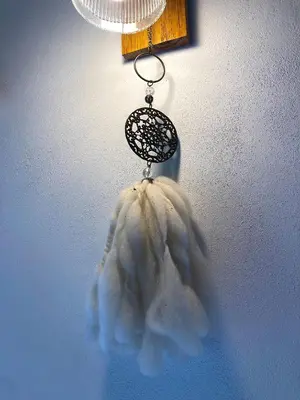 a cloud shaped toy hanging from a light fixture at Cabañas Yin y Yang in Pueblito