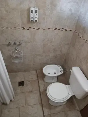 a bathroom with a toilet and a sink at Cabañas Yin y Yang in Pueblito