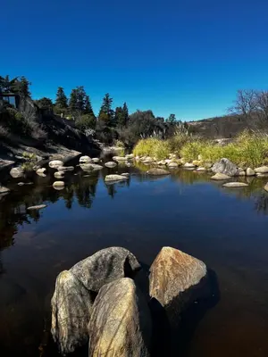 a river with large rocks in the water at Casa Campo Cordoba Cabalango in Cavalango