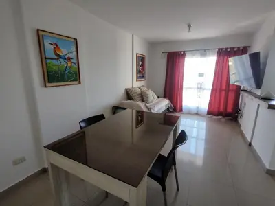 a kitchen and living room with a table and chairs at Departamento Lautaro III Alta Cordoba Cofico in Cordoba