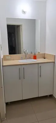 a bathroom with a sink and a mirror at Departamento Lautaro III Alta Cordoba Cofico in Cordoba