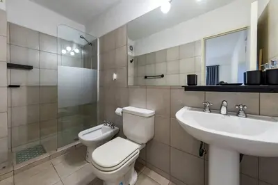 a bathroom with a toilet and a sink at Viaggiato Felix Frías in Cordoba