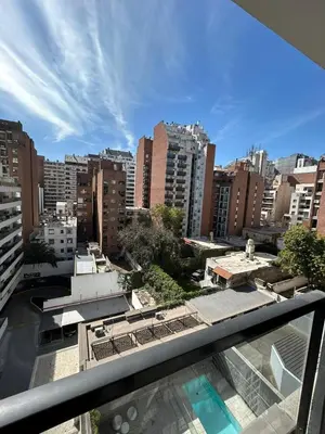 a view of a city from the balcony of a building at Departamento -Peredo- 2 cuadras de plaza España-Cuidad universitaria By Apartcba in Cordoba