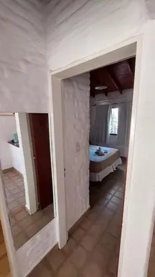 a room with a bedroom with a bed in it at CASA TILO con pileta exclusiva in Mina Clavero
