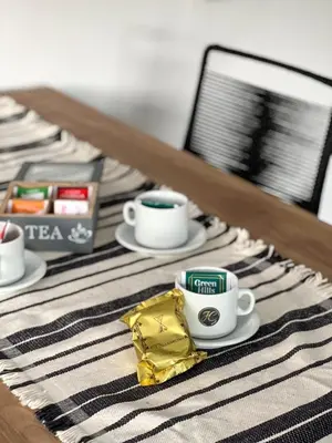 a table with two coffee cups and a napkin at JC Apart 2 in Cordoba