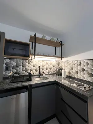 a kitchen with a sink and a counter top at JC Apart 2 in Cordoba