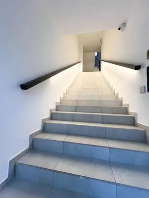 a staircase in a building with blue steps at JC Apart 2 in Cordoba