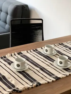 three coffee cups sitting on top of a table at JC Apart 2 in Cordoba