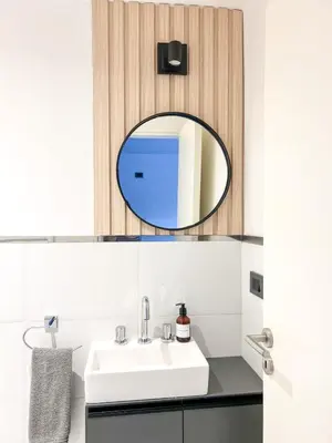 a bathroom with a sink and a mirror at JC Apart 2 in Cordoba