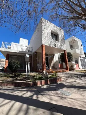 a large white building with at Hotel Grisabel in Villa Carlos Paz