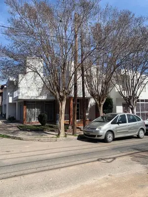 a silver car parked in front of a house at Hotel Grisabel in Villa Carlos Paz