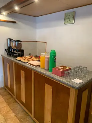 a counter in a kitchen with some food on it at Hotel Grisabel in Villa Carlos Paz