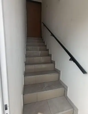 a staircase in a building with a door at Altos de Horizonte I in Cordoba