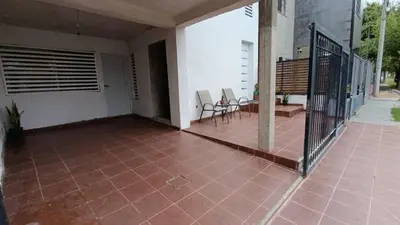 a patio with chairs and a table on a house at Altos de Horizonte I in Cordoba