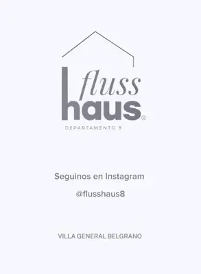 a logo for a real estate agency with a house at Flusshaus8 in Villa General Belgrano