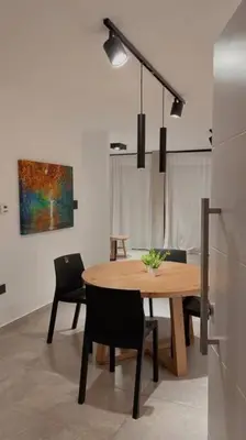 a dining room with a wooden table and chairs at Atp Bolivia 164 in Cordoba