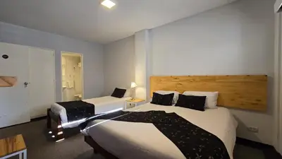 a hotel room with two beds in a room at Santiago Hotel in Cordoba