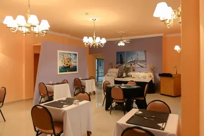 a dining room with tables and chairs in it at Santiago Hotel in Cordoba