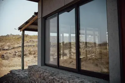 a window of a house with a view of the mountains at Cabaña en Tala Cruz a 9km de Villa Cañada del Sauce in Tala Cruz