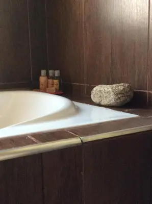 a bath tub sitting on a counter in a bathroom at Senderos del Tao in Las Rabonas