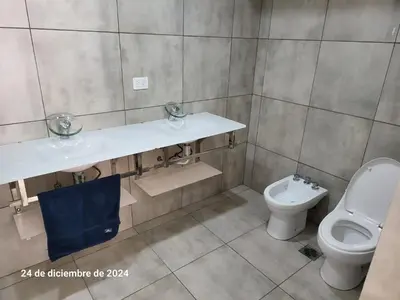 a bathroom with a sink and a toilet at Calasanz Premium in Cordoba