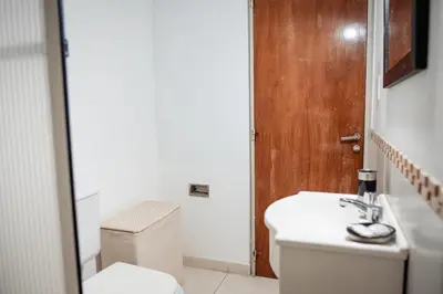 a bathroom with a toilet and a sink at Dpto 1 hab con cochera in Cordoba