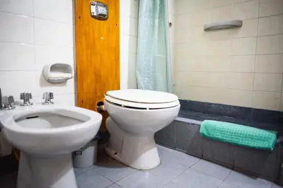 a bathroom with a toilet and a sink at Dpto 1 habitación con cochera in Cordoba