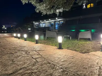 a row of lights on a sidewalk at night at Ciervo de Oro in Villa Carlos Paz