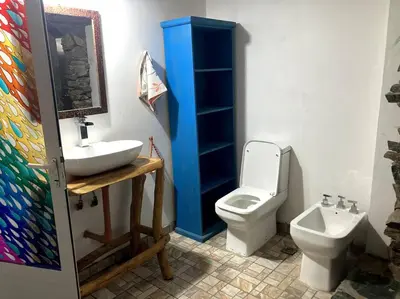 a bathroom with a sink and a toilet at Casita Sirio in Mina Clavero