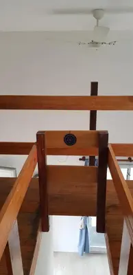 a close up of a wooden table in a room at Tiny Samay Punto Claro in Villa Ciudad Parque