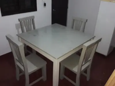 a white table and chairs in a room at El Dpto de Gabicito II in Cordoba