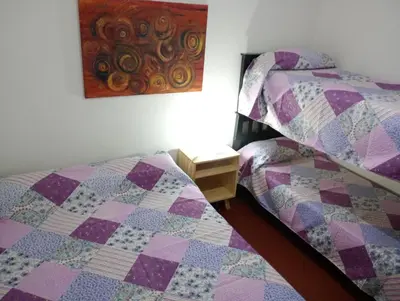 two beds sitting next to each other in a bedroom at El Dpto de Gabicito II in Cordoba