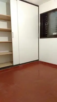 a room with white doors and a red floor at El Dpto de Gabicito II in Cordoba