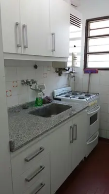 a kitchen with a sink and a stove at El Dpto de Gabicito II in Cordoba